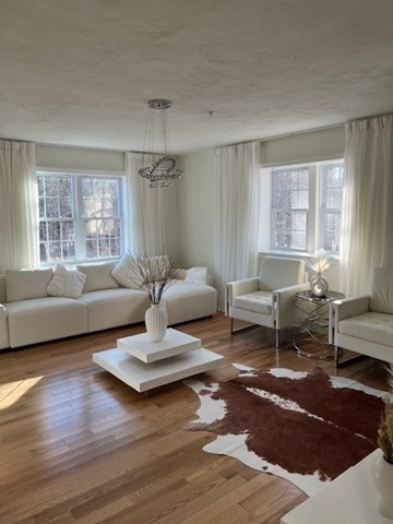 35 Fredonian Street, Unit K Shirley, MA 01464 - Photo 3 of 18 a living room with furniture or window and a wooden floor