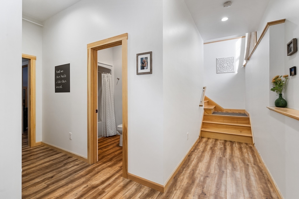79 Burt Road Westhampton, MA 01027 - Photo 36 of 42 a view of a hallway with wooden floor and staircase