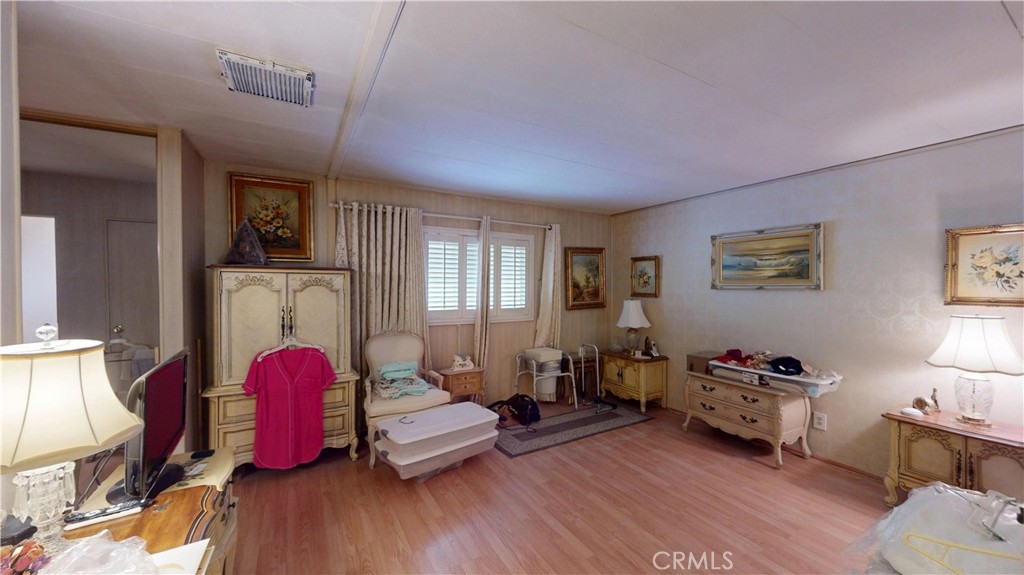 14851 Jeffrey Road, Unit 117 Irvine, CA 92618 - Photo 26 of 45 a bedroom with furniture and a window