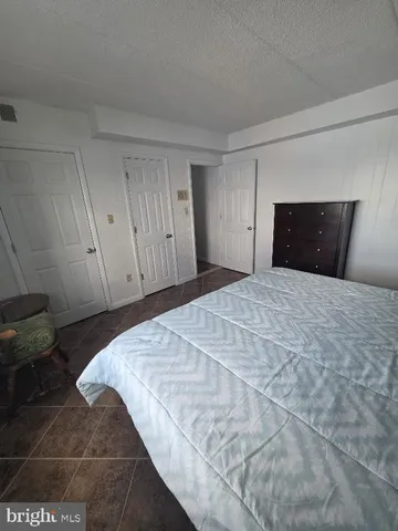 a large bed sitting in a bedroom and closet
