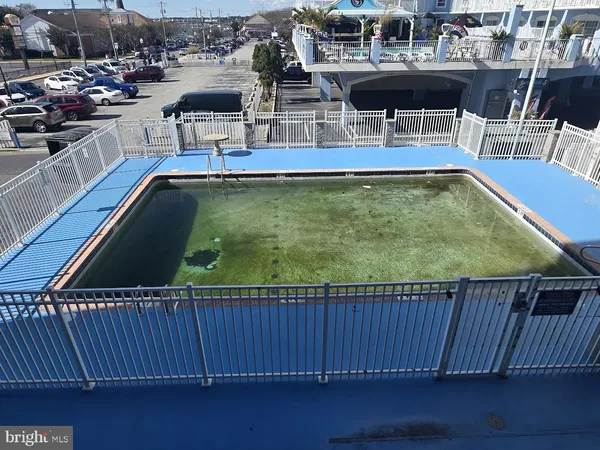 a swimming pool with outdoor seating and outdoor view