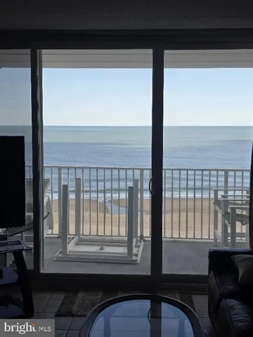 a view of a room that has a large window