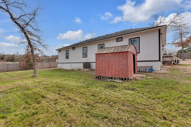 a view of a house with a snow in the yard