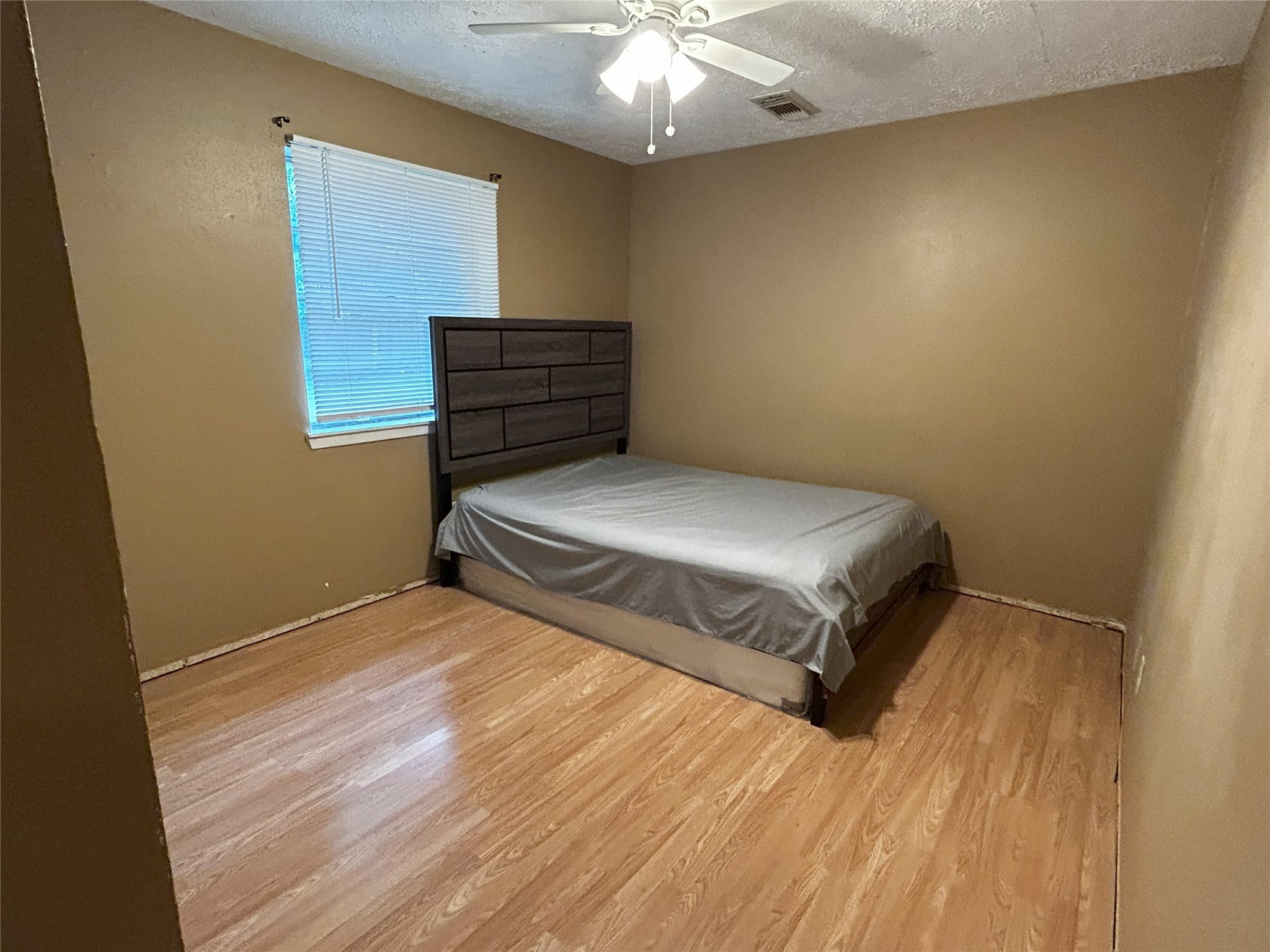 4330 Tylergate Drive Spring, TX 77373 - Photo 12 of 25 a bedroom with a bed and a dresser