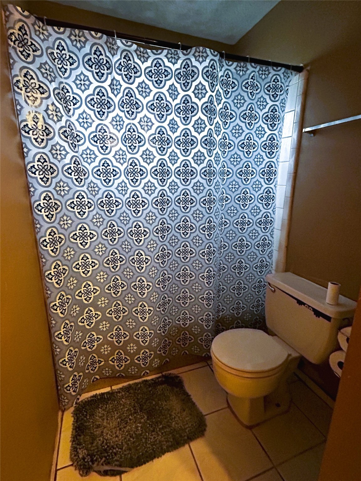 4330 Tylergate Drive Spring, TX 77373 - Photo 15 of 25 a bathroom with a toilet and a shower curtain