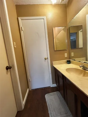 a bathroom with sink vanity and a mirror