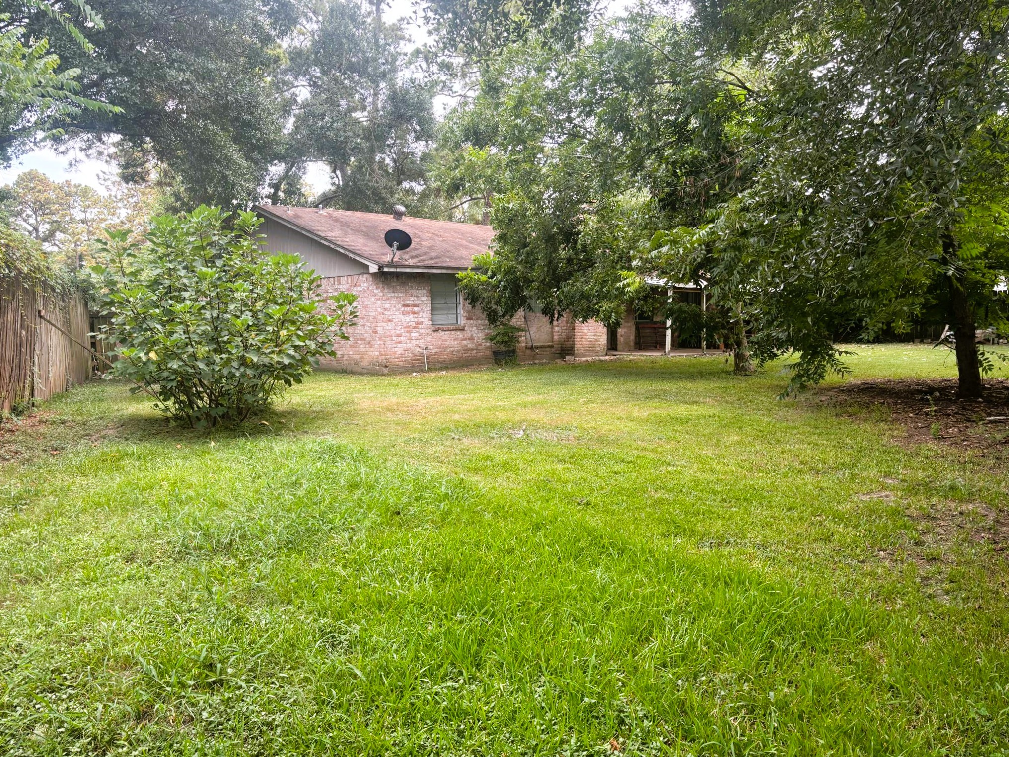 4330 Tylergate Drive Spring, TX 77373 - Photo 23 of 25 a backyard of a house with table and chairs