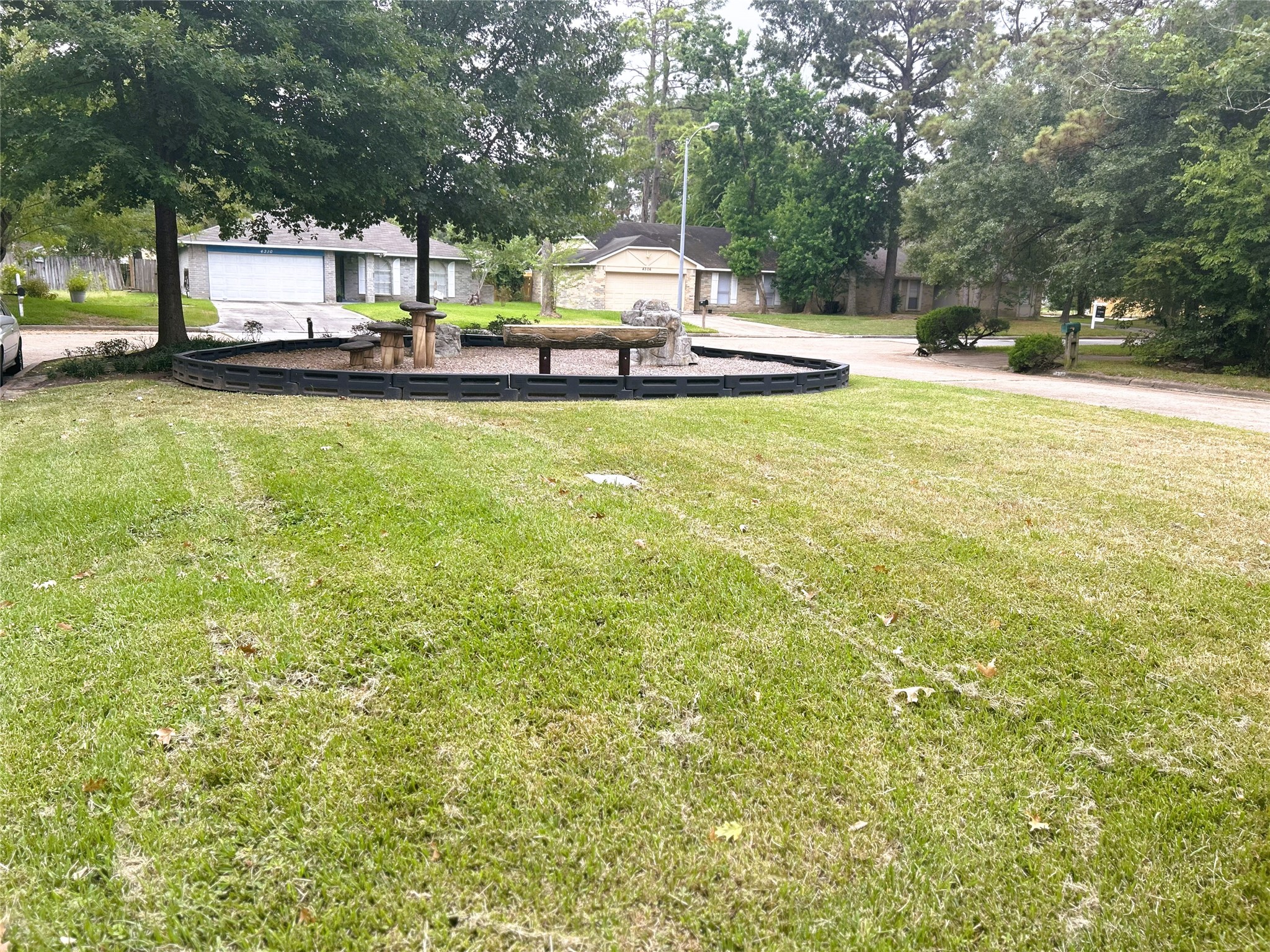 4330 Tylergate Drive Spring, TX 77373 - Photo 25 of 25 a view of a swimming pool and trees in the background