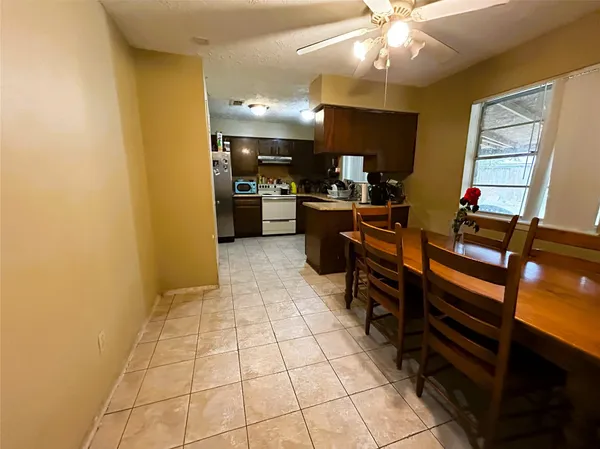 a kitchen with a sink cabinets and appliances