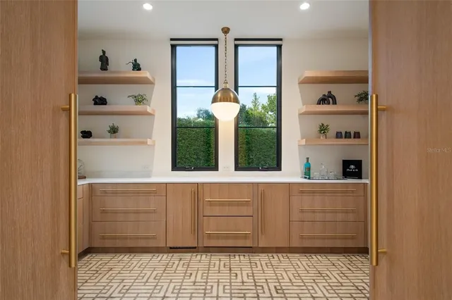 a kitchen with a window and cabinets