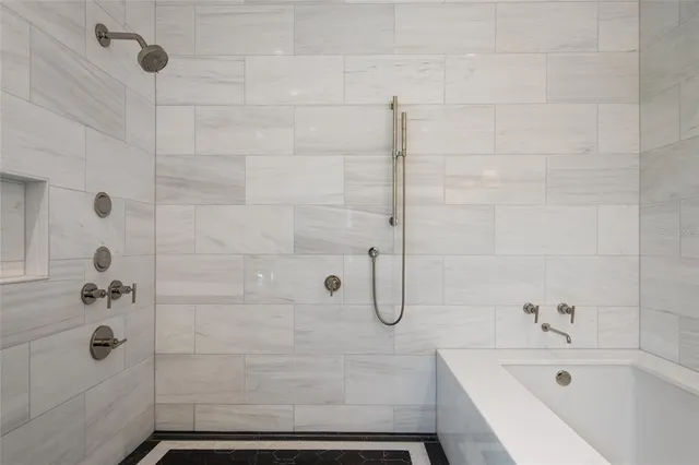 a bathroom with a toilet sink vanity and mirror