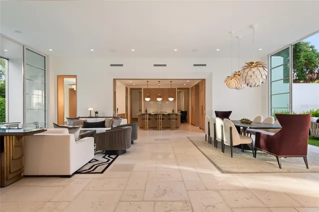 a large kitchen with lots of counter and chairs