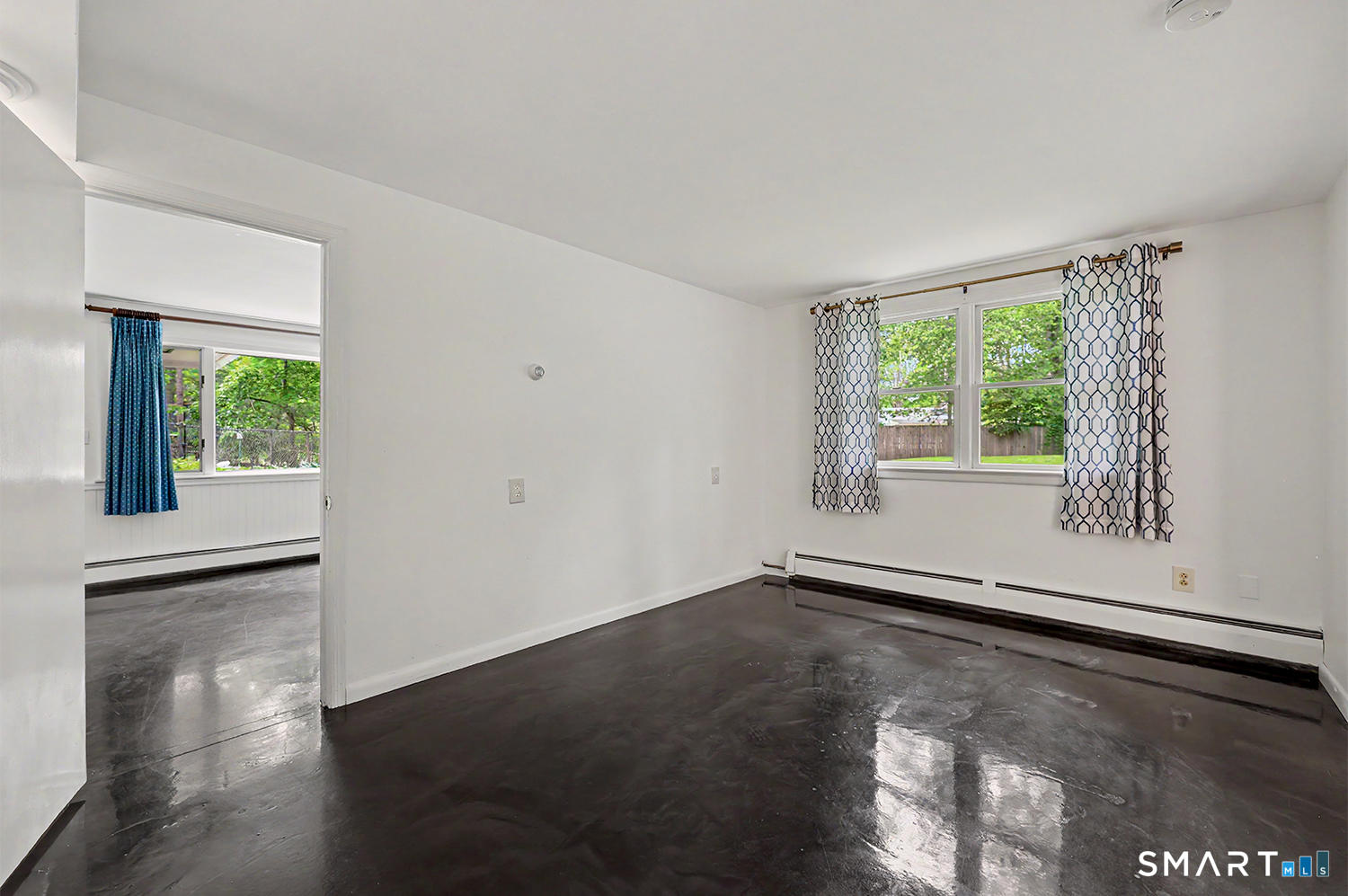 19 Geneva Road Norwalk, CT 06850 - Photo 22 of 33 an empty room with wooden floor and windows