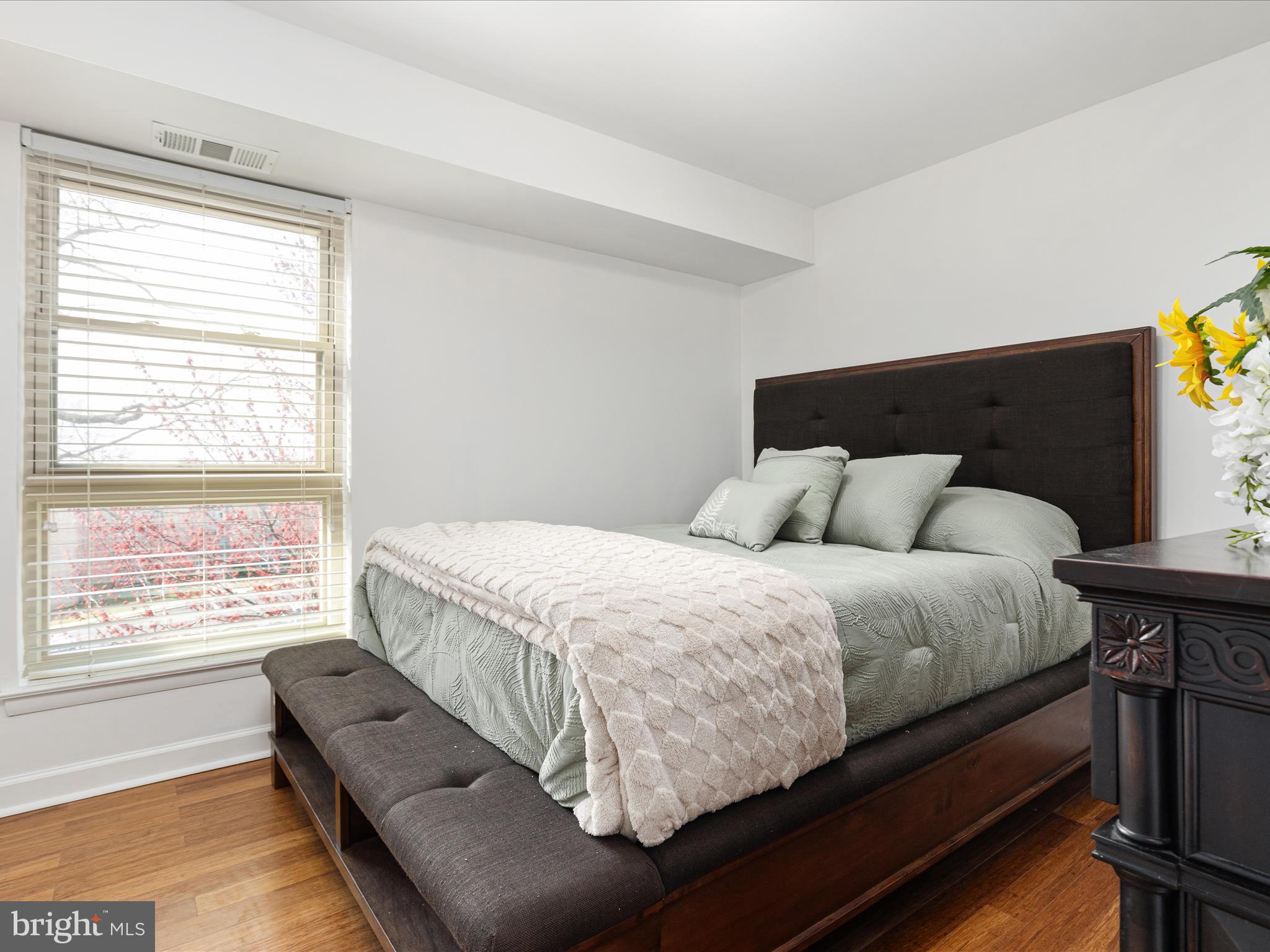 2303 Greenery Lane, Unit 2034 Silver Spring, MD 20906 - Photo 17 of 30 a bedroom with bed and window