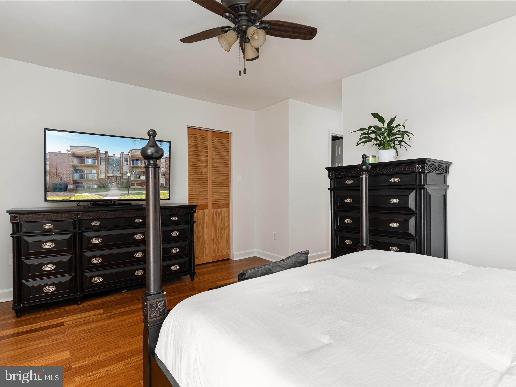 2303 Greenery Lane, Unit 2034 Silver Spring, MD 20906 - Photo 20 of 30 a bed room with a bed and a television