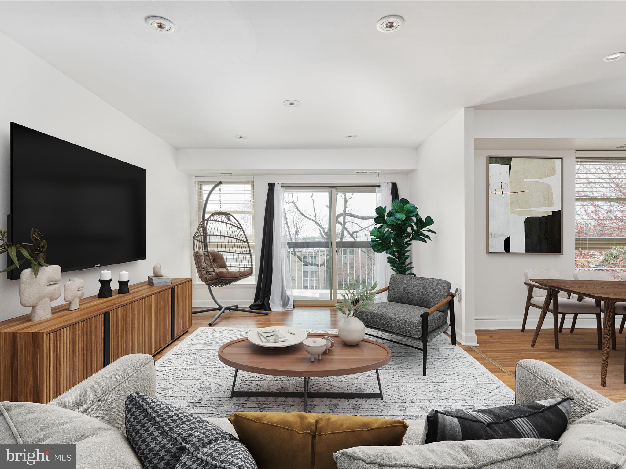 2303 Greenery Lane, Unit 2034 Silver Spring, MD 20906 - Photo 3 of 30 a living room with furniture and a flat screen tv
