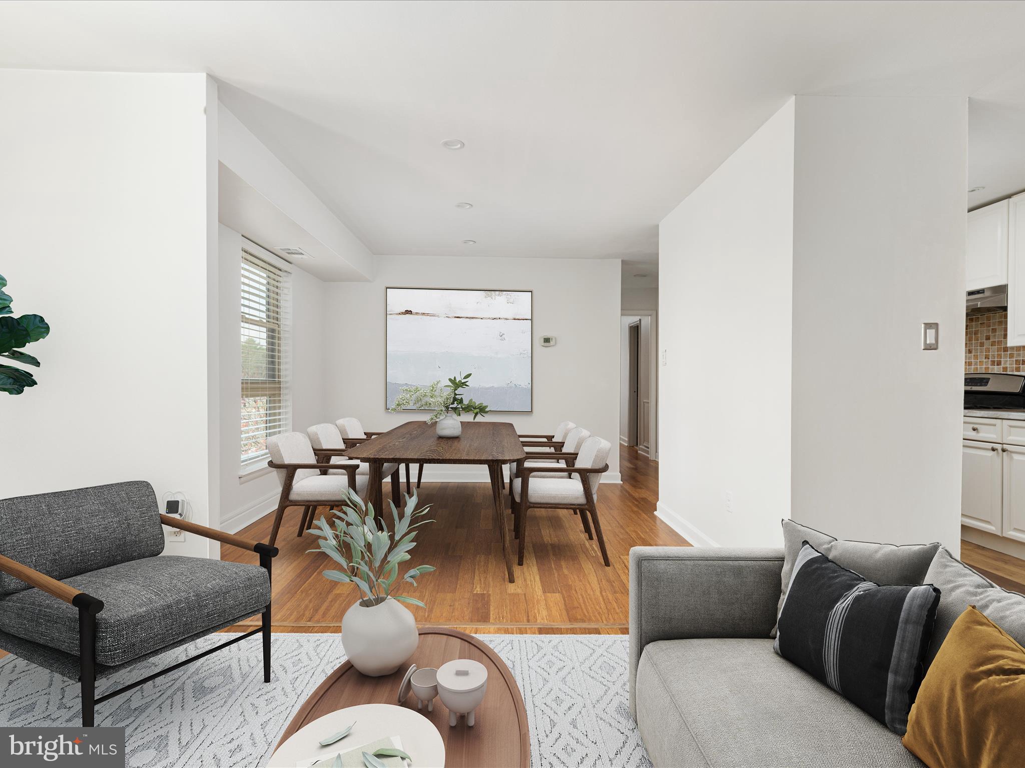 2303 Greenery Lane, Unit 2034 Silver Spring, MD 20906 - Photo 7 of 30 a living room with furniture and a table