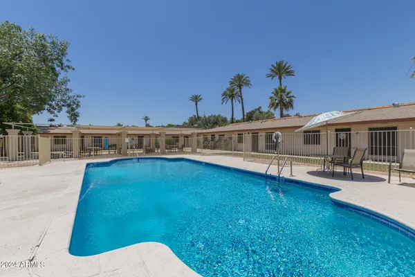 a view of a house with swimming pool