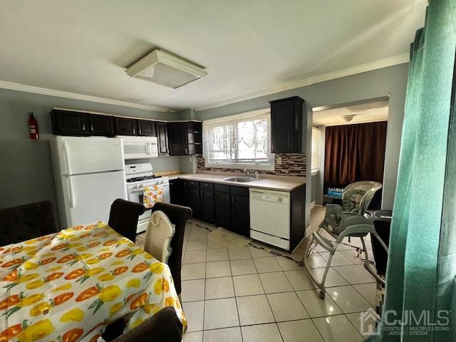 10 Romney Road Bound Brook, NJ 08805 - Photo 11 of 14 a kitchen with a refrigerator a stove a sink a dining table and chairs