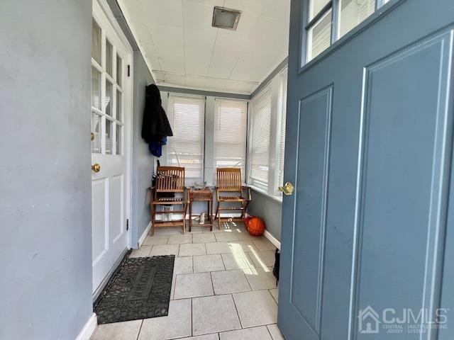 10 Romney Road Bound Brook, NJ 08805 - Photo 3 of 14 a hallway with a dining table and a stove top oven
