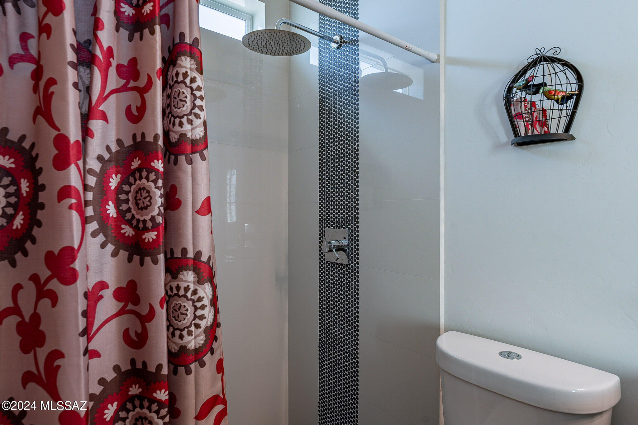 176 Avenida Ostion Rio Rico, AZ 85648 - Photo 37 of 48 a bathroom with a toilet and a shower curtain