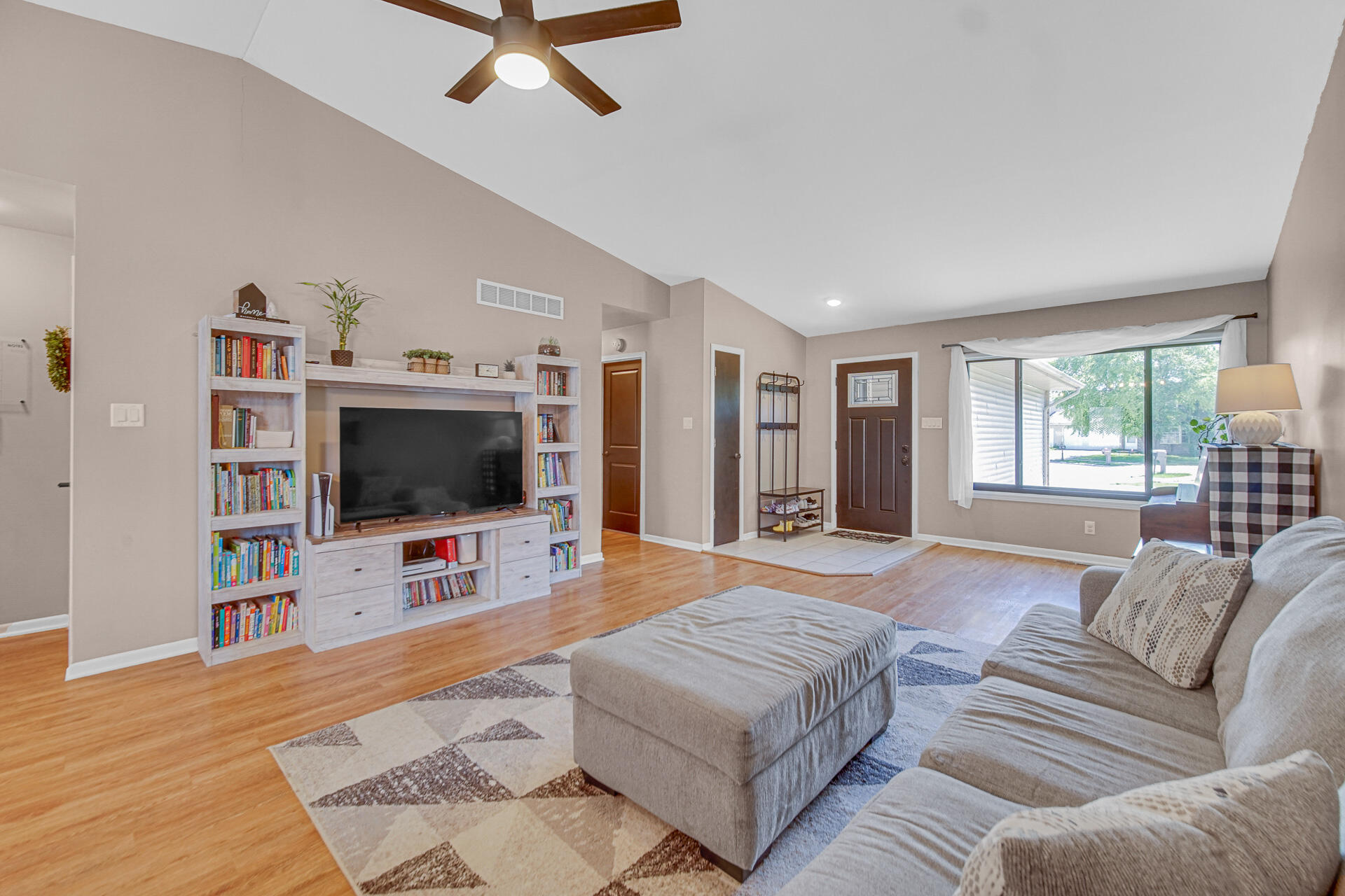 4942 West 93rd Court Crown Point, IN 46307 - Photo 5 of 37 a living room with furniture and a flat screen tv