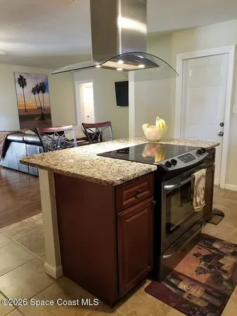 a kitchen with a stove and a sink