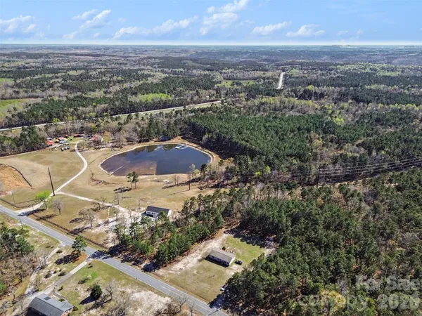 an aerial view of a house with outdoor space
