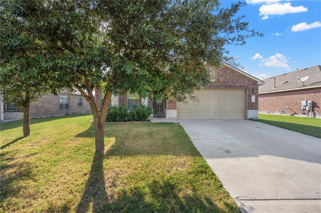 20224 Merlin Falcon Trail Pflugerville, TX 78660 - Photo 38 of 40 A well-maintained lawn and sturdy brick exterior welcome you to this charming single-story residence.