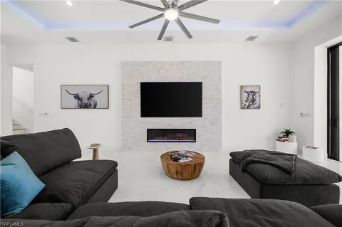 a living room with furniture a fireplace