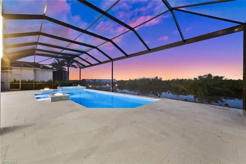 a view of a swimming pool with a yard