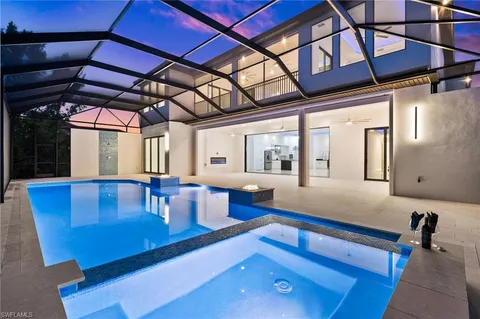 a living room with hard wood floors and a table