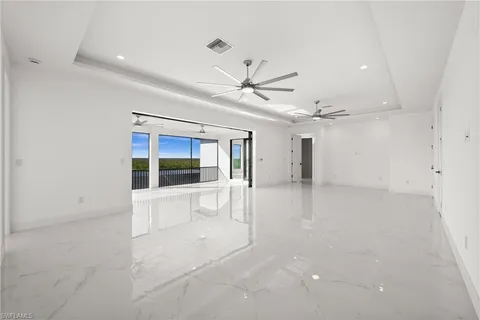 a view of empty room with a ceiling fan