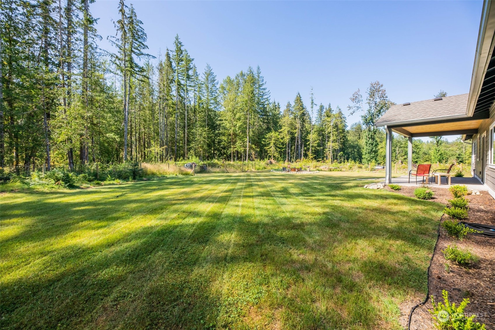36016 Mann Road Sultan, WA 98294 - Photo 28 of 39 a swimming pool with outdoor seating and yard