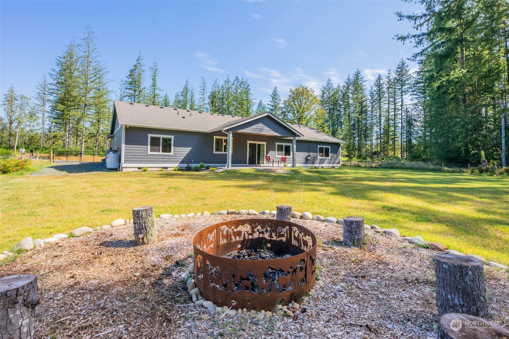 36016 Mann Road Sultan, WA 98294 - Photo 32 of 39 a view of a house with swimming pool and a yard