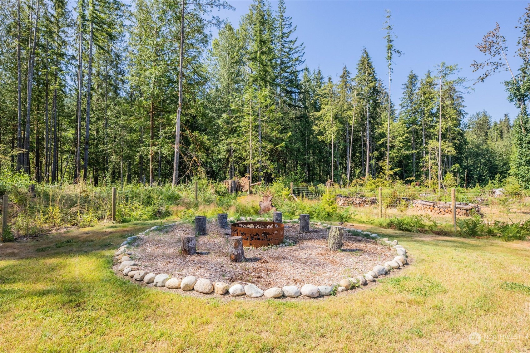 36016 Mann Road Sultan, WA 98294 - Photo 34 of 39 a view of a swimming pool with a sitting area
