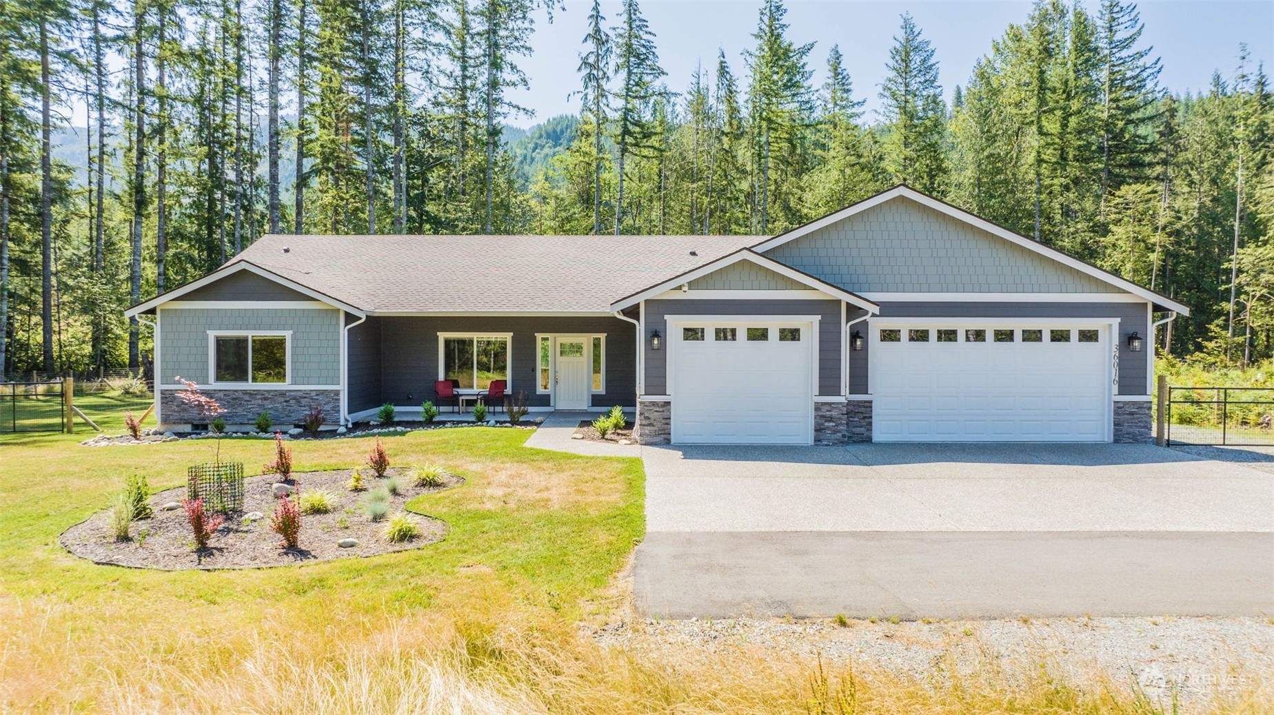 36016 Mann Road Sultan, WA 98294 - Photo 4 of 39 a house with a swimming pool in front of it