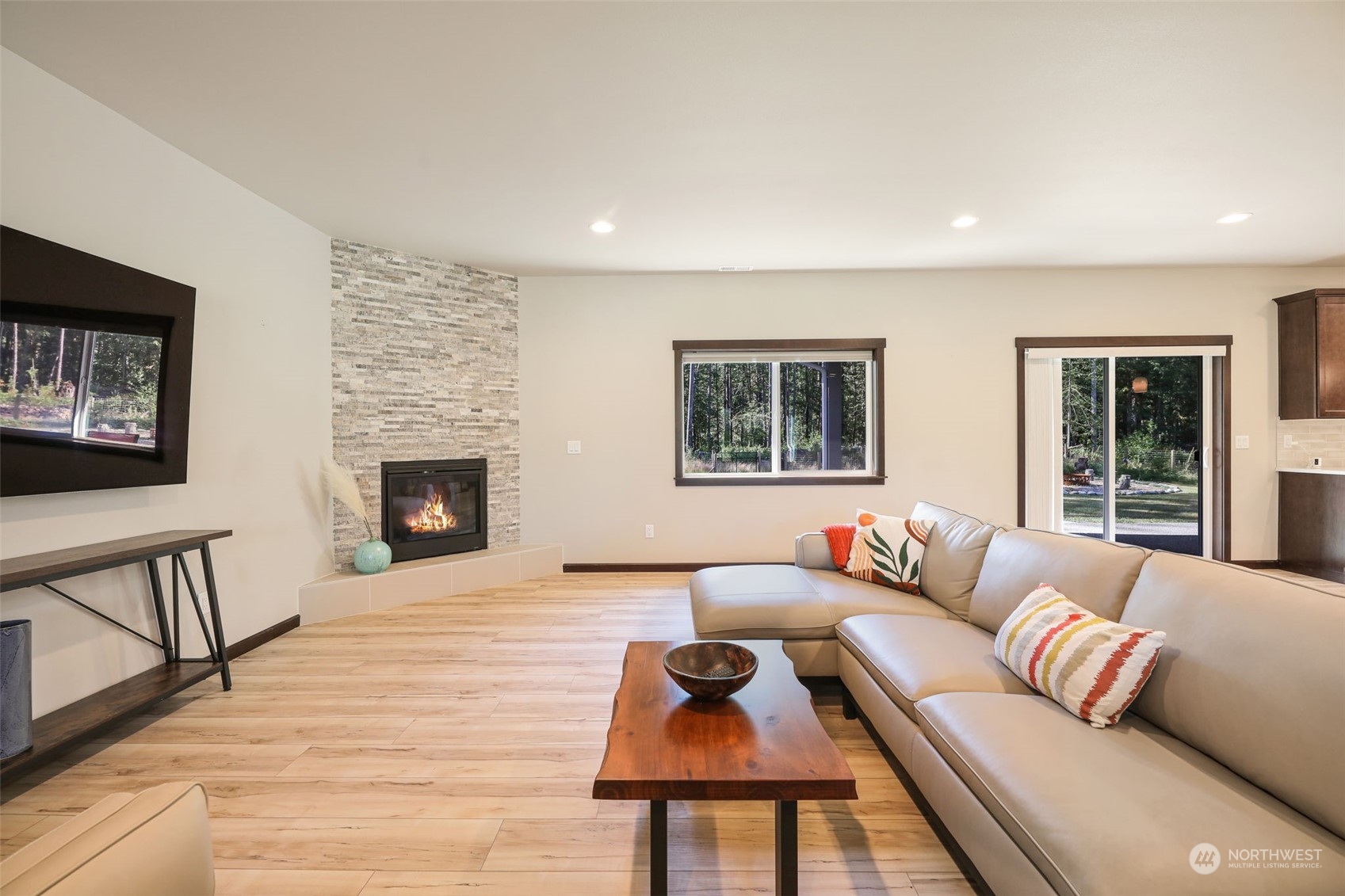 36016 Mann Road Sultan, WA 98294 - Photo 6 of 39 a living room with furniture and a fireplace