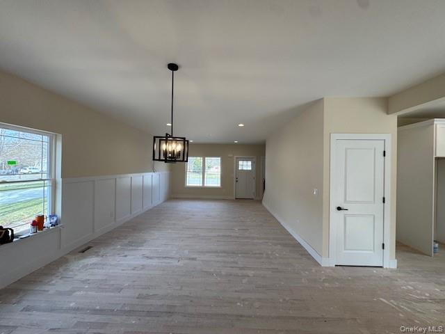 N/c Westfield Lot 0 Rd Coram, NY 11727 - Photo 3 of 29 a view of a hallway with windows and chandelier