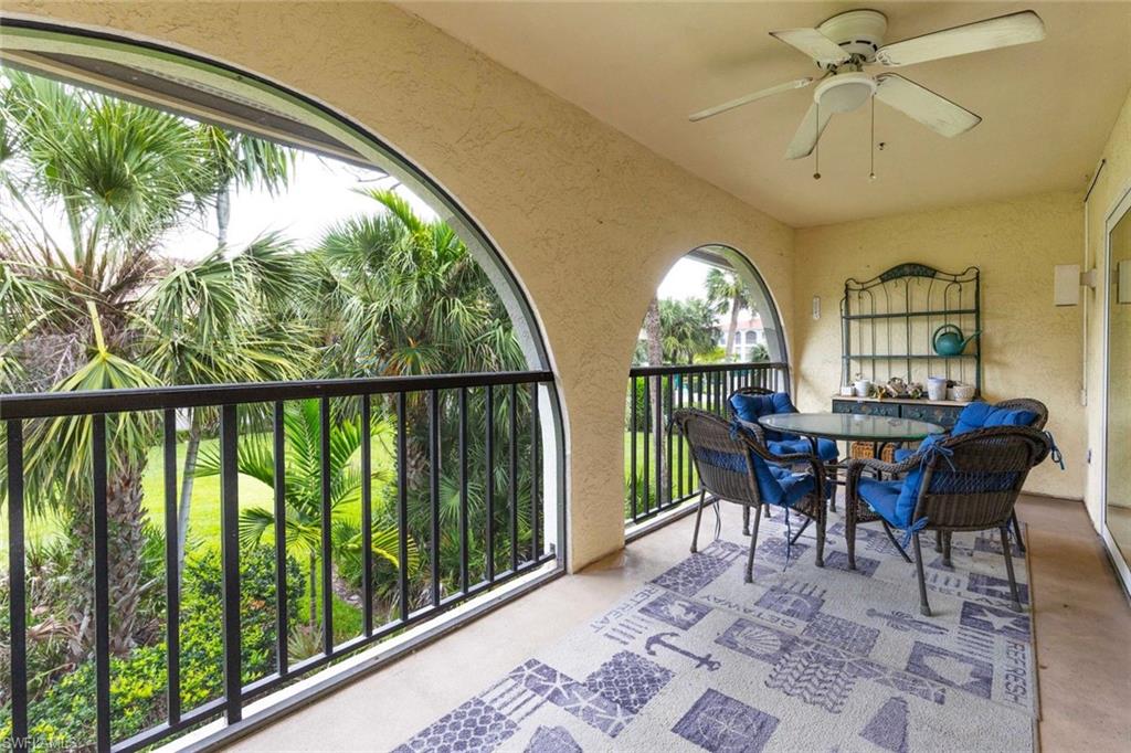 3360 10th Street North, Unit 1210 Naples, FL 34103 - Photo 11 of 28 a view of a dining room with furniture window and outside view