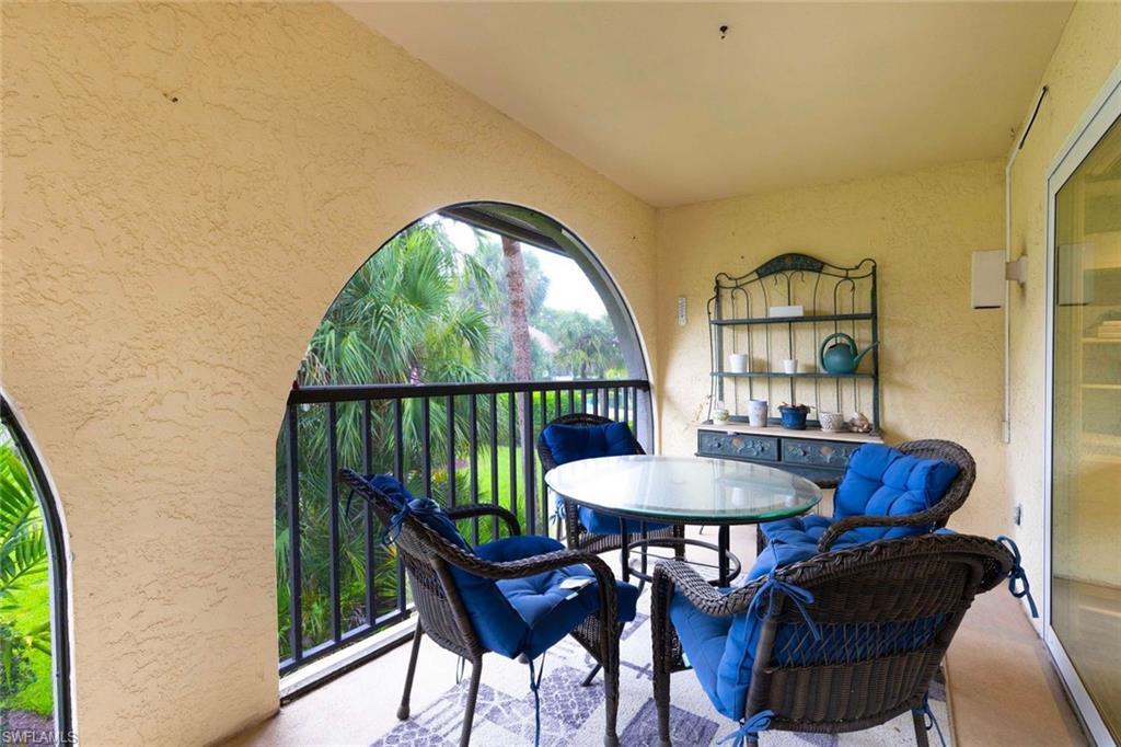 3360 10th Street North, Unit 1210 Naples, FL 34103 - Photo 10 of 28 a dining room with furniture and window