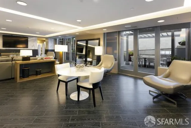 a living room with fireplace furniture and a flat screen tv