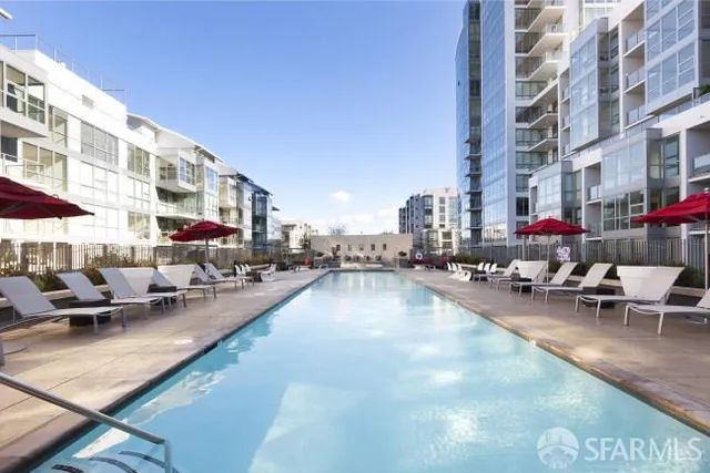 a view of swimming pool with outdoor seating