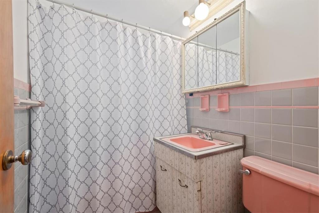 463 1st Street Pittsburgh, PA 15227 - Photo 11 of 20 a bathroom with a sink and a toilet