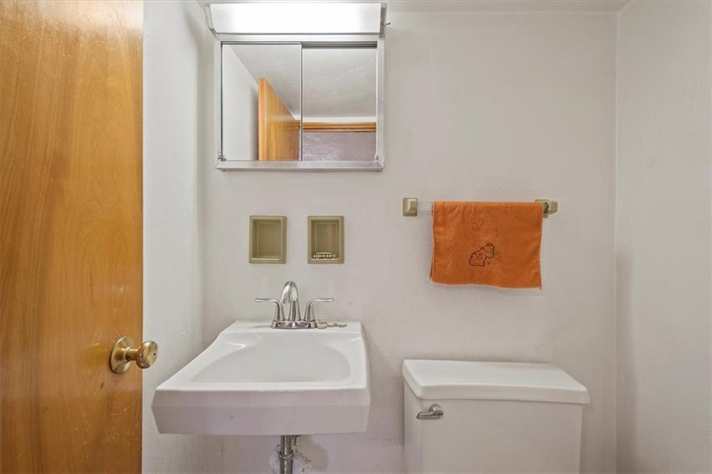 463 1st Street Pittsburgh, PA 15227 - Photo 18 of 20 a bathroom with a sink and a toilet