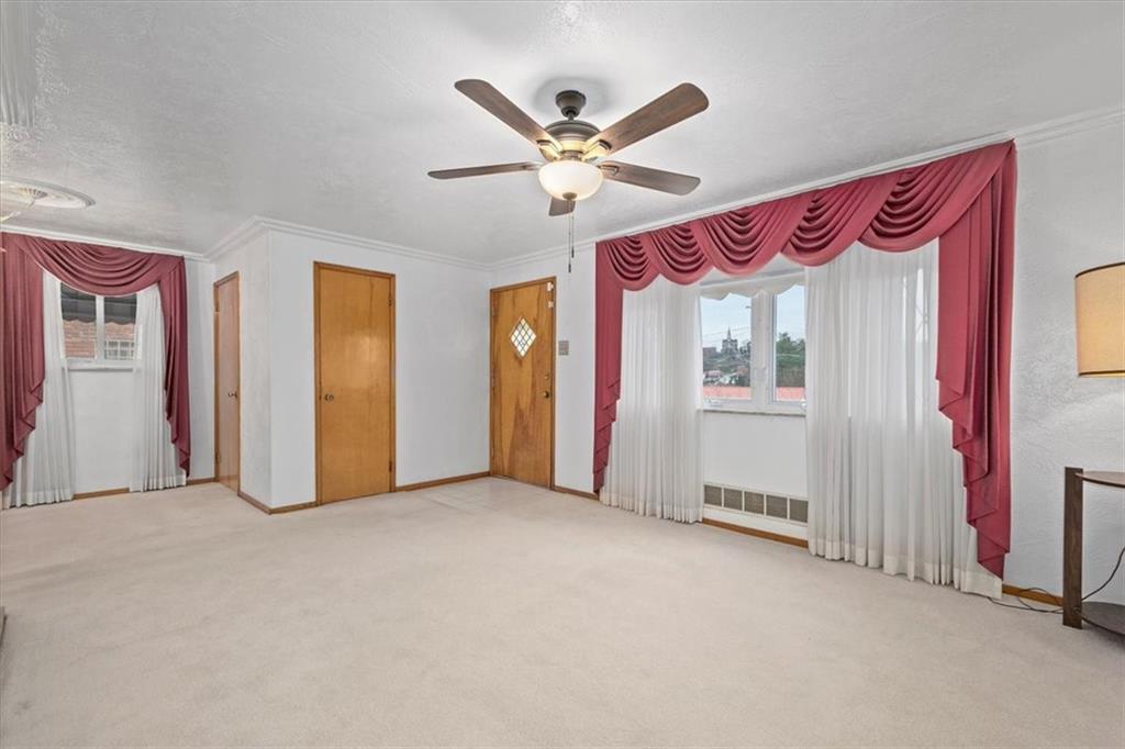 463 1st Street Pittsburgh, PA 15227 - Photo 5 of 20 a view of an empty room with a ceiling fan
