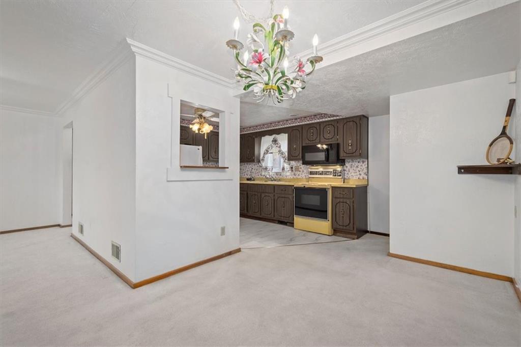 463 1st Street Pittsburgh, PA 15227 - Photo 7 of 20 a view of a kitchen with a sink cabinet and a window