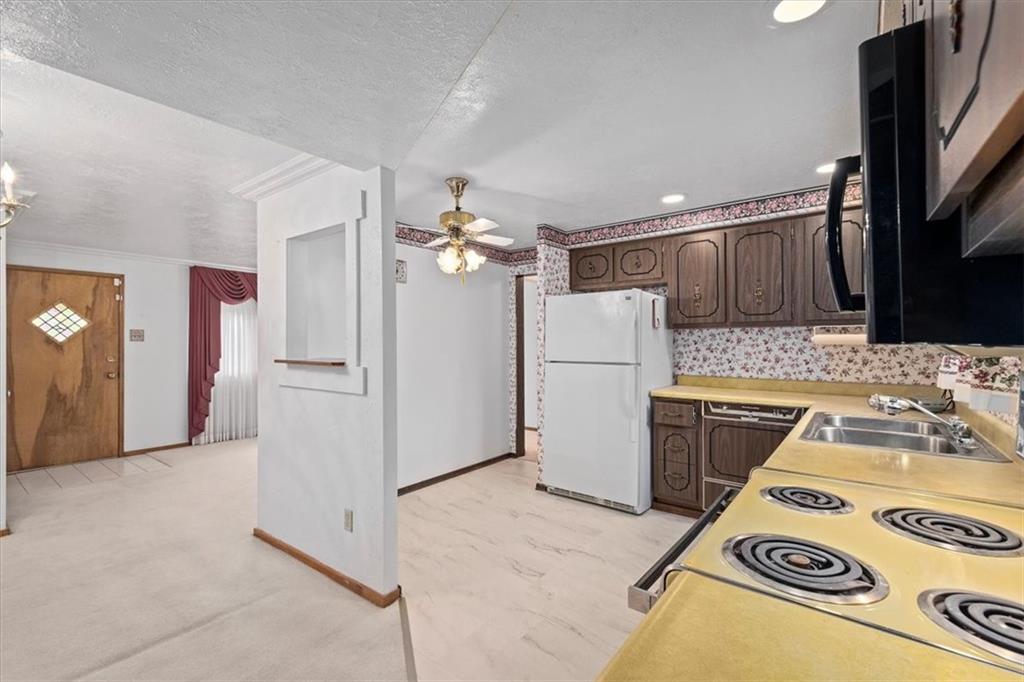 463 1st Street Pittsburgh, PA 15227 - Photo 9 of 20 a kitchen with a refrigerator and a sink