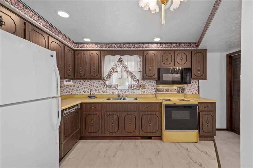 463 1st Street Pittsburgh, PA 15227 - Photo 10 of 20 a spacious bathroom with a granite countertop sink and a mirror