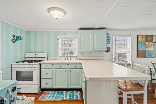 a bathroom with a sink a mirror and a window